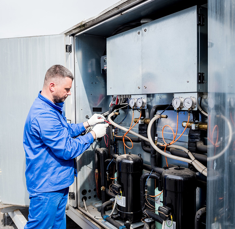 Technician repairing industrial equipment
